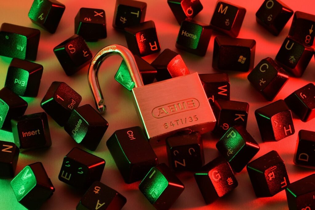 Open padlock among scattered keyboard keys, a warning about unsafe websites