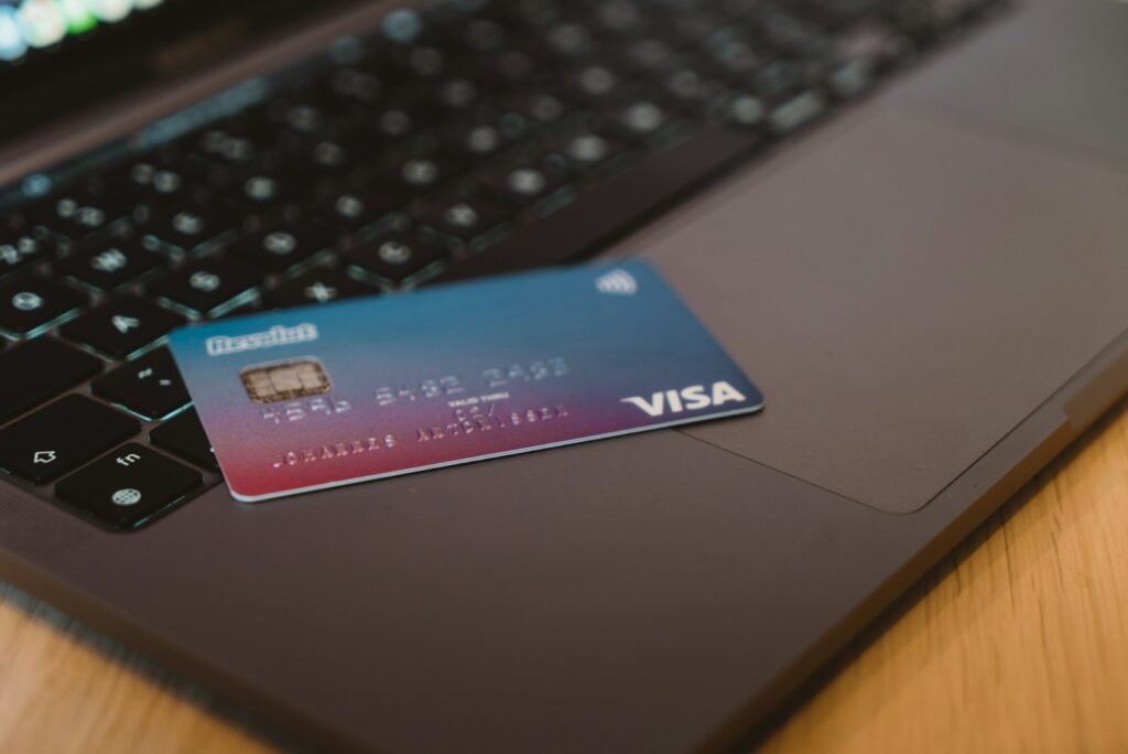 Payment card resting on a laptop, representing safe online payment
